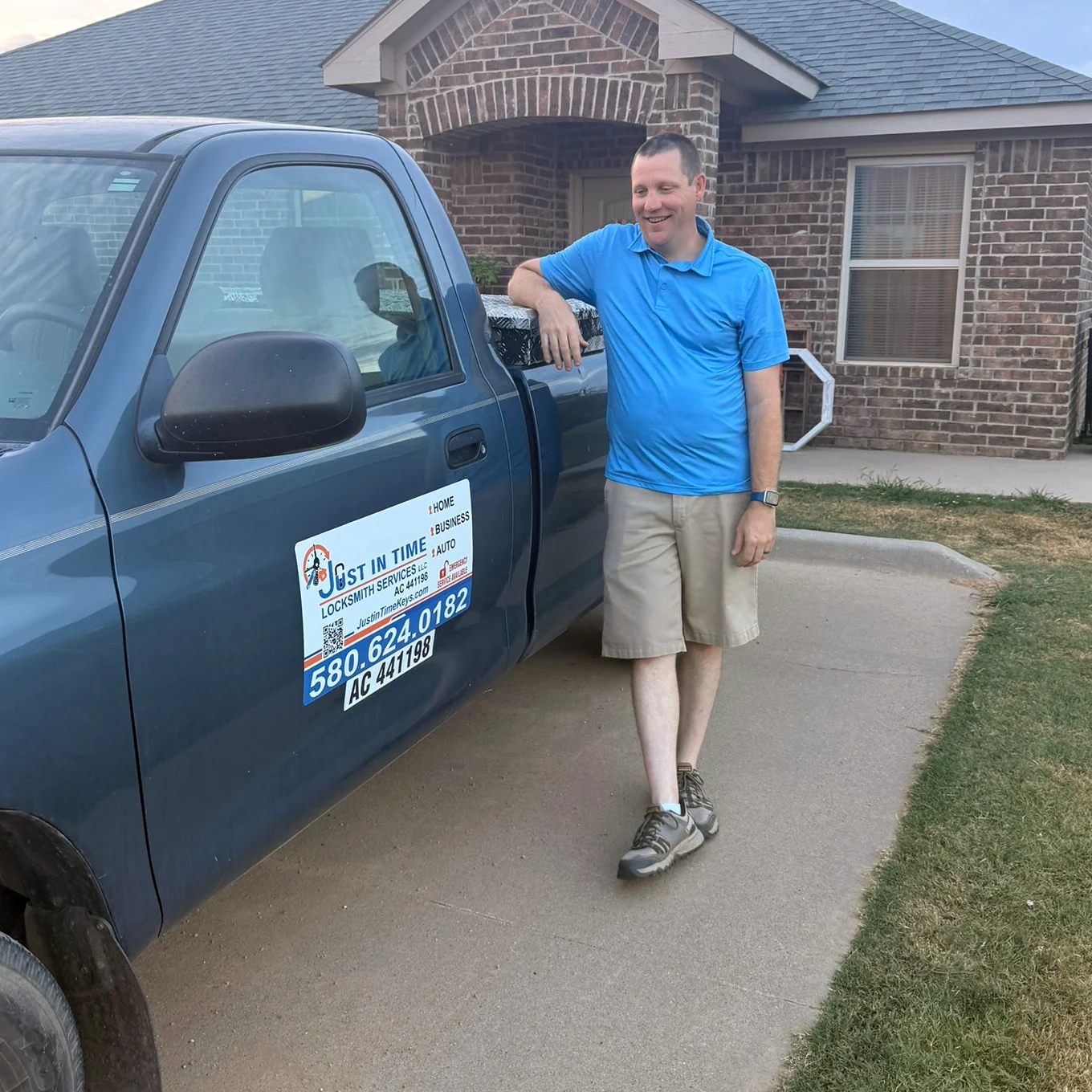 Justin beside his branded locksmith service truck