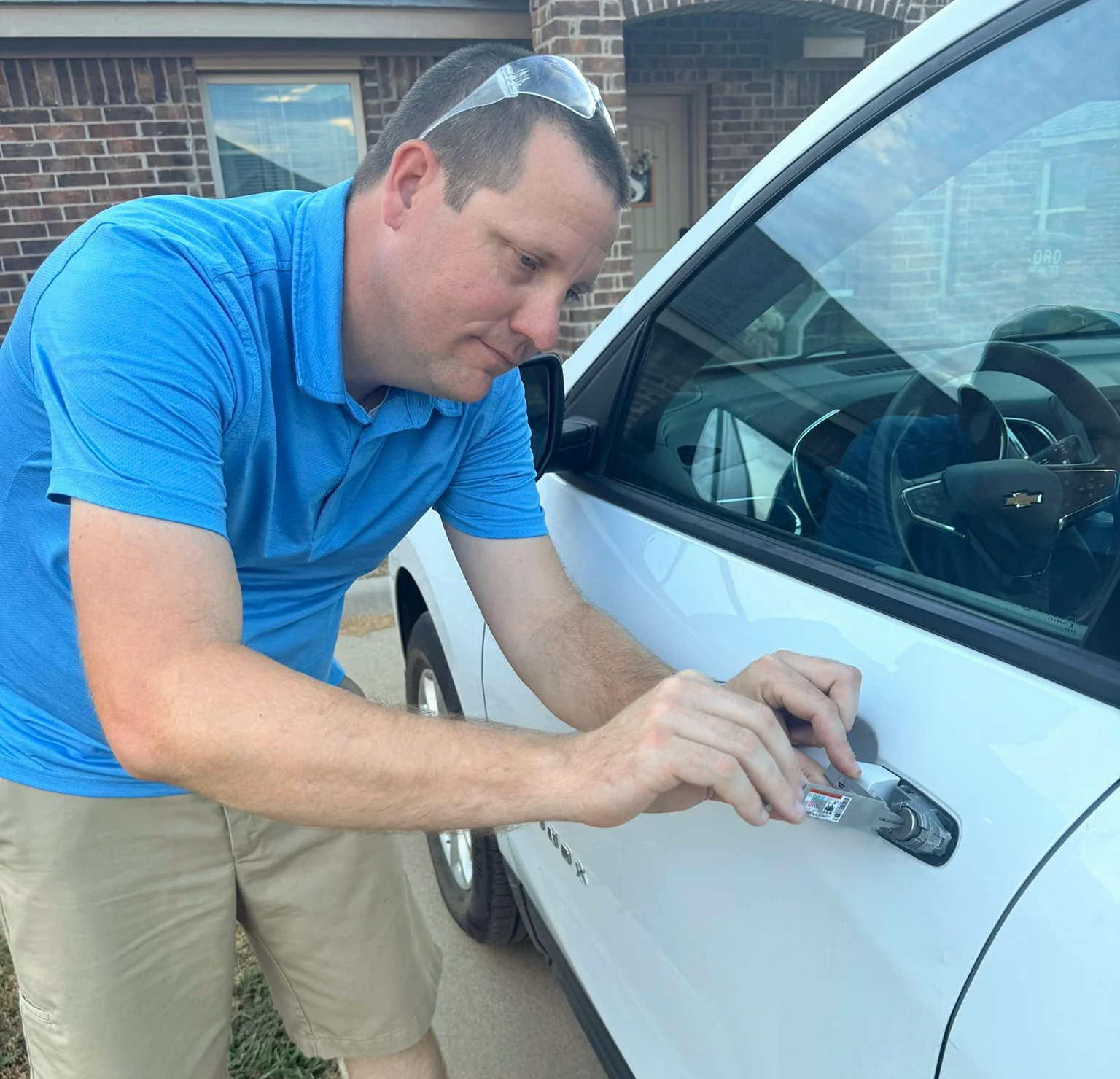 Justin working on a vehicle door lock